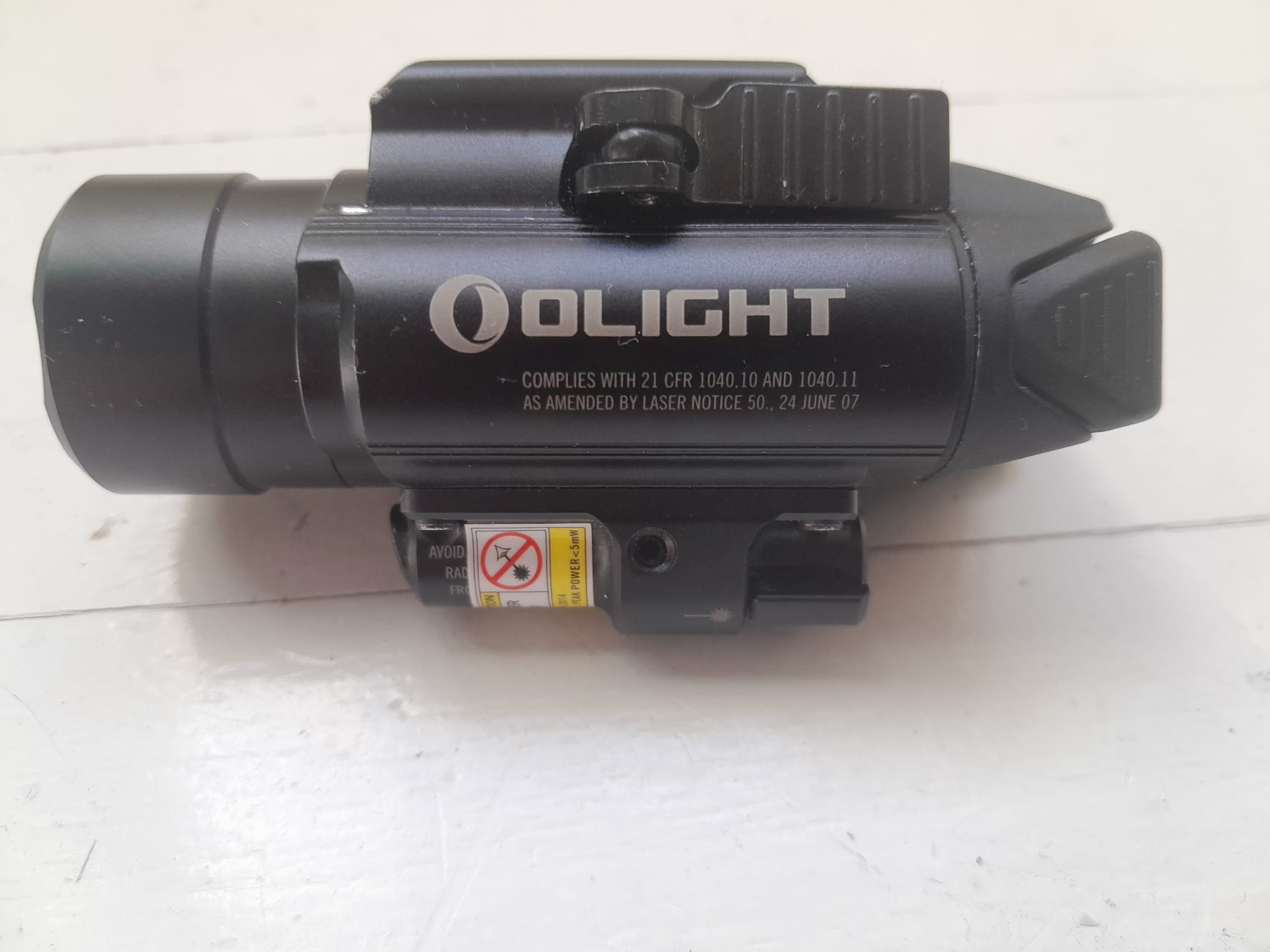 Olight Baldr RL – Lampe Tactique 1120 Lumens + Laser Rouge (État Nickel)