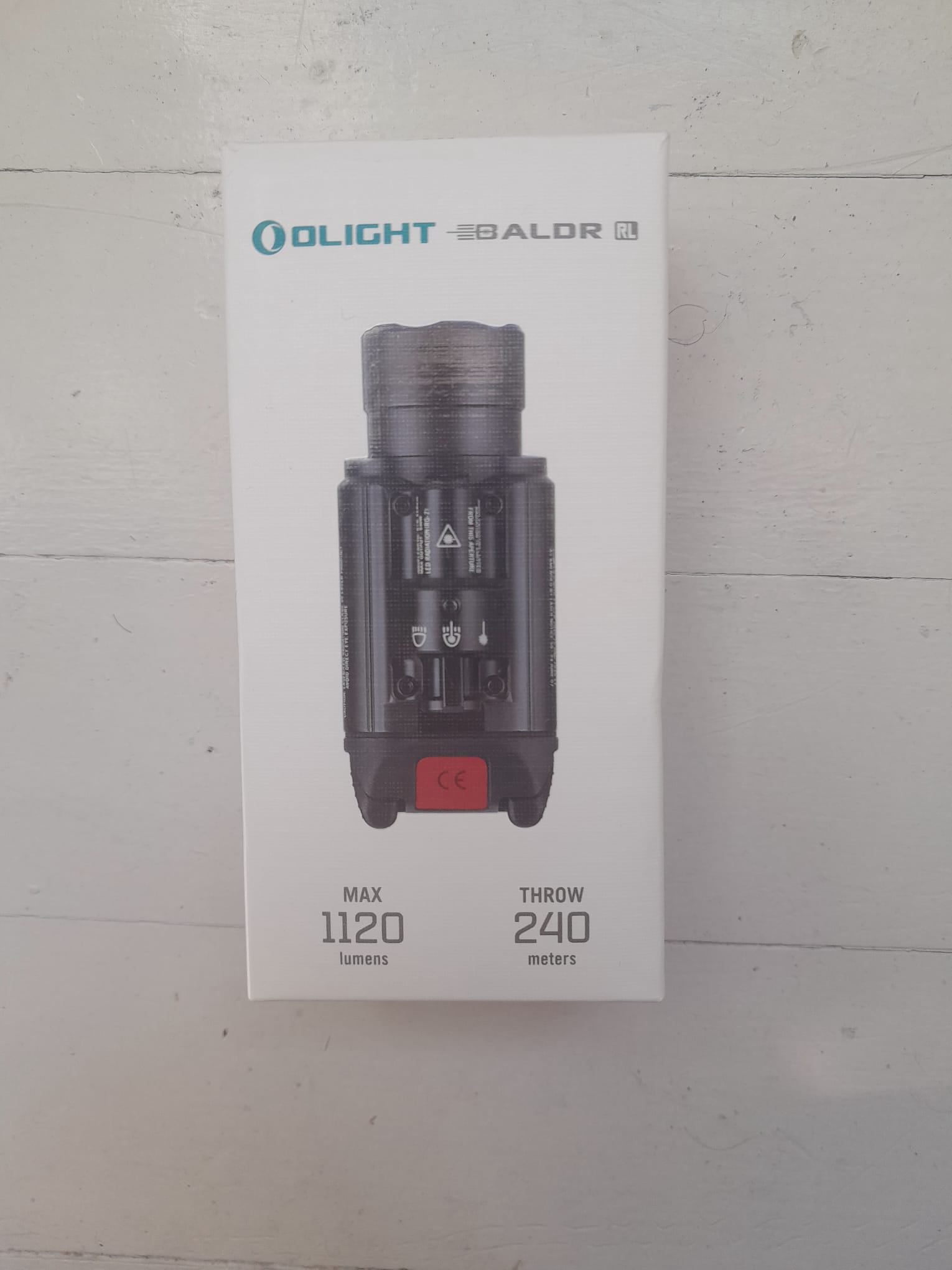 Olight Baldr RL – Lampe Tactique 1120 Lumens + Laser Rouge (État Nickel)